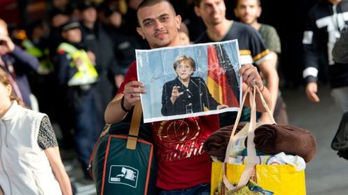 muslimrefugeecuddlespictureofmerkel1